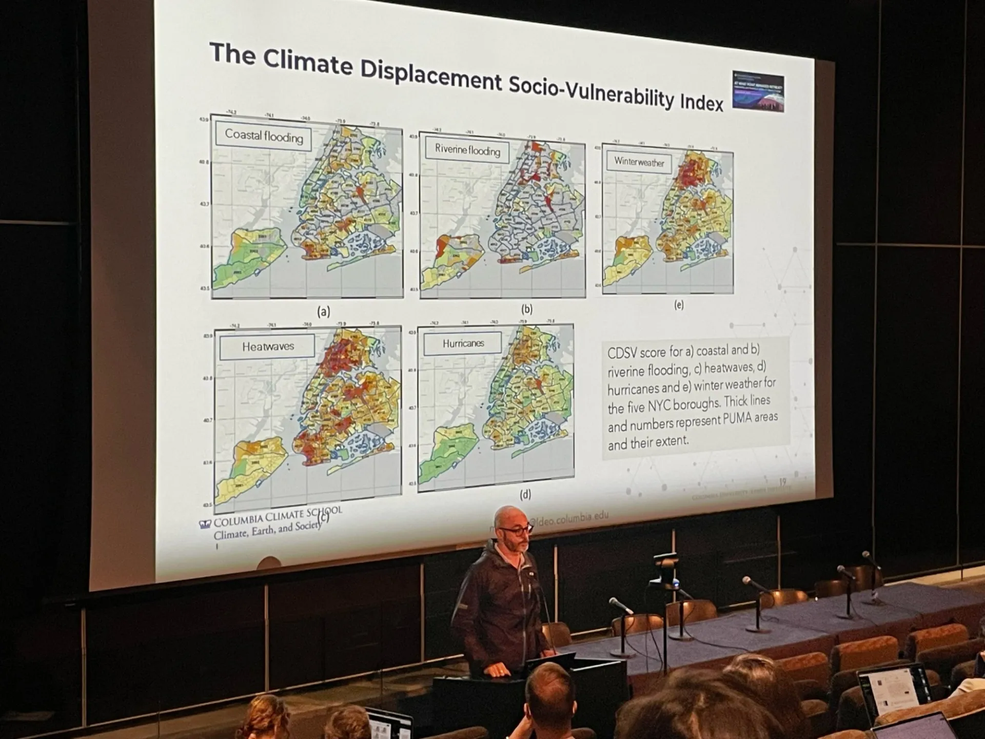 Marco Tedesco presents a slide on the Climate Displacement and Social Vulnerability Index.